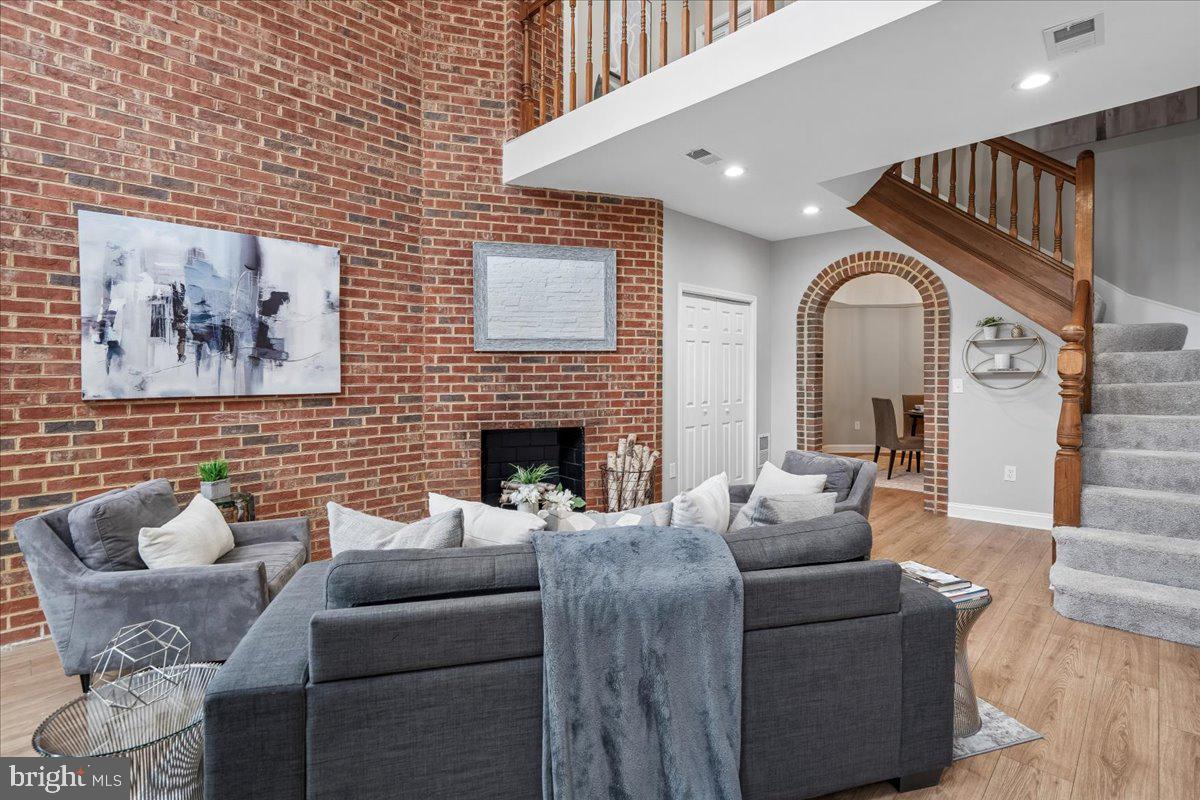 817 4th Street Northeast Washington, DC 20002 - Photo 5 of 40 a living room with furniture and a fireplace