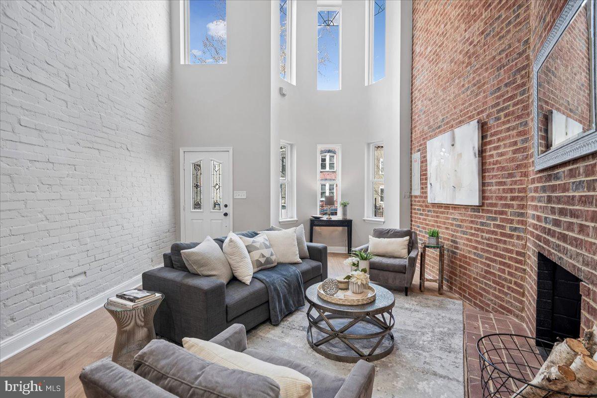 817 4th Street Northeast Washington, DC 20002 - Photo 6 of 40 a living room with furniture and a fireplace