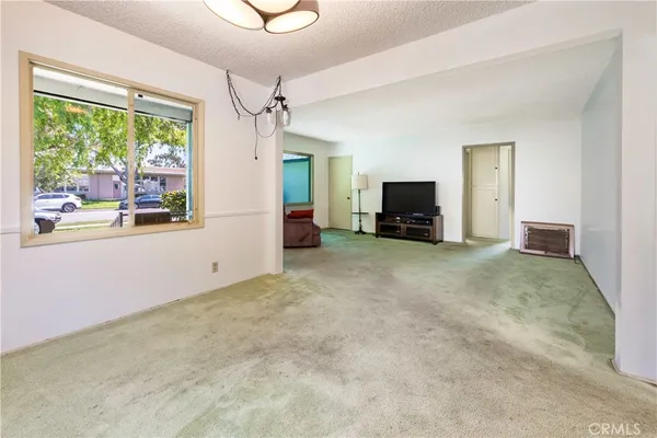 a view of a livingroom with furniture and windows