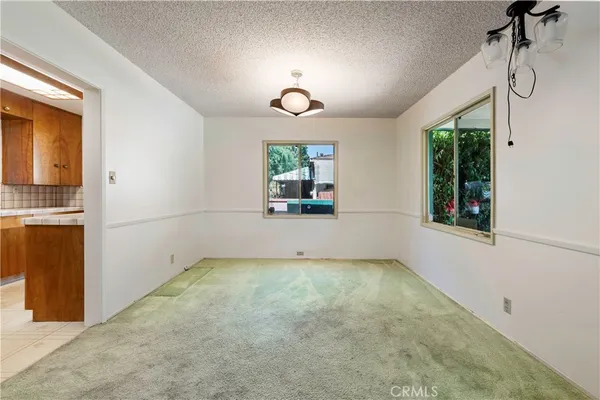 a view of a room with window and mirror