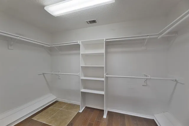 a view of an empty walk in closet