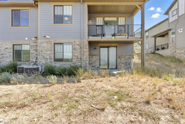 6039 North Westridge Road Heber City, UT 84032 - Photo 20 of 22 Exterior featuring stone veneer and light gray horizontal siding