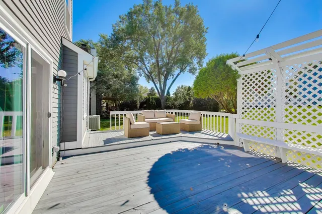 a view of a house with a yard and sitting area