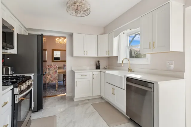 a kitchen with a sink stove and cabinets