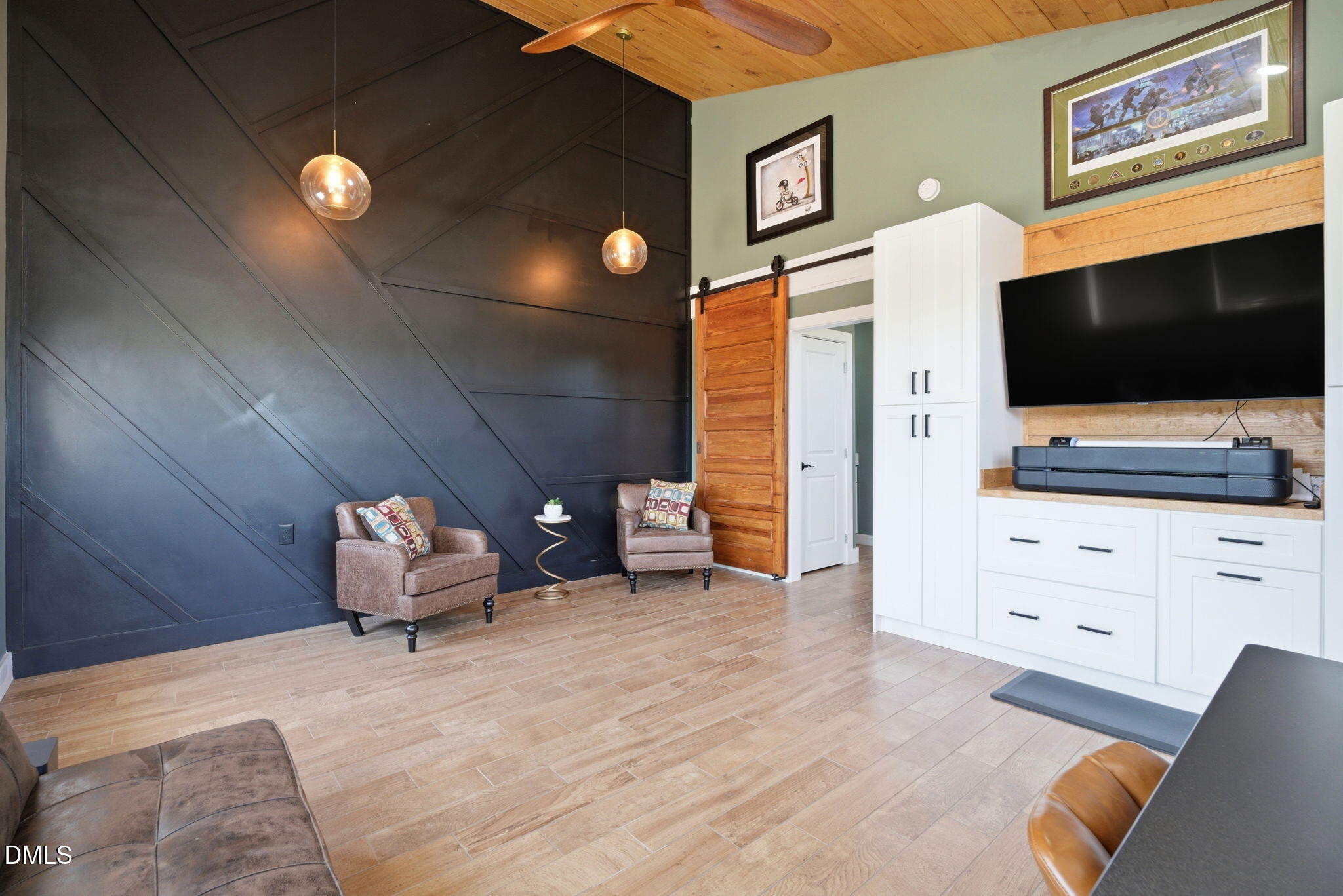 5416 Pulley Town Road Zebulon, NC 27597 - Photo 60 of 74 a bedroom with furniture and a flat screen tv