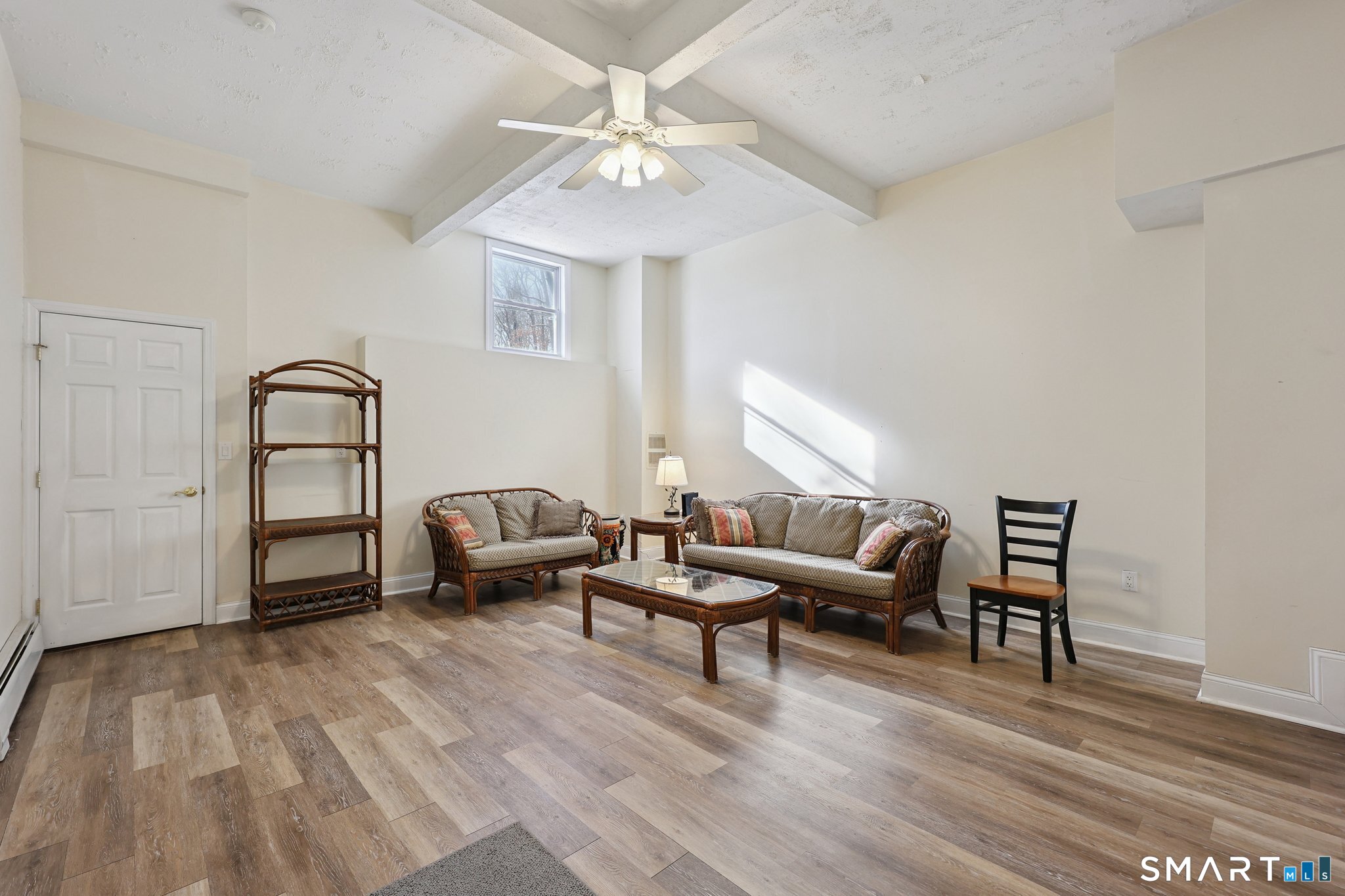 36 Bigelow Road New Fairfield, CT 06812 - Photo 22 of 37 Bedroom 3 on lower level leads to 3rd garage space. 10'+ ceiling in this room.