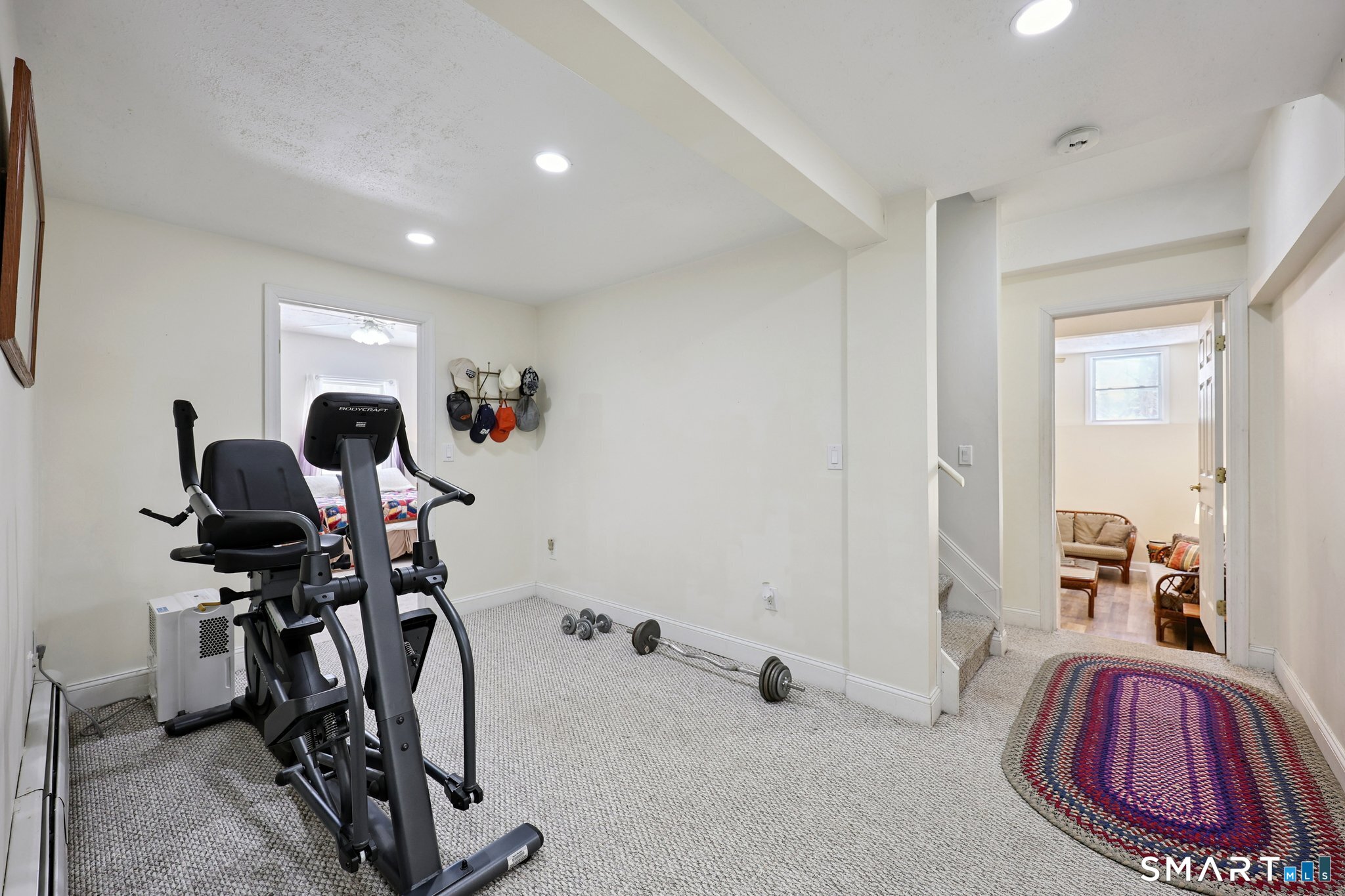 36 Bigelow Road New Fairfield, CT 06812 - Photo 26 of 37 Extra room between lower level bedrooms with full bath and access to mechanical room/storage space.