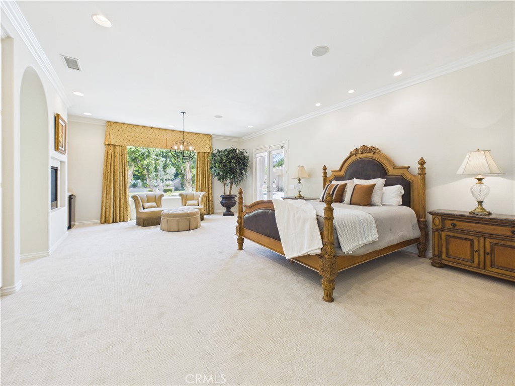 1662 Cherokee Road Corona, CA 92881 - Photo 32 of 60 a spacious bedroom with a bed and window