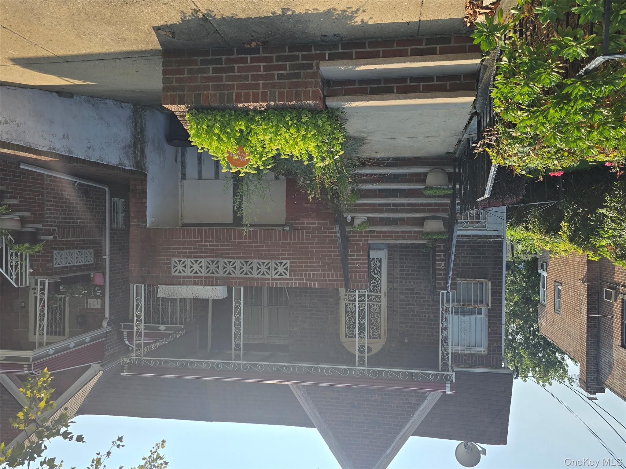142 East 88th Street Brooklyn, NY 11236 - Photo 11 of 14 a front view of a house with entryway