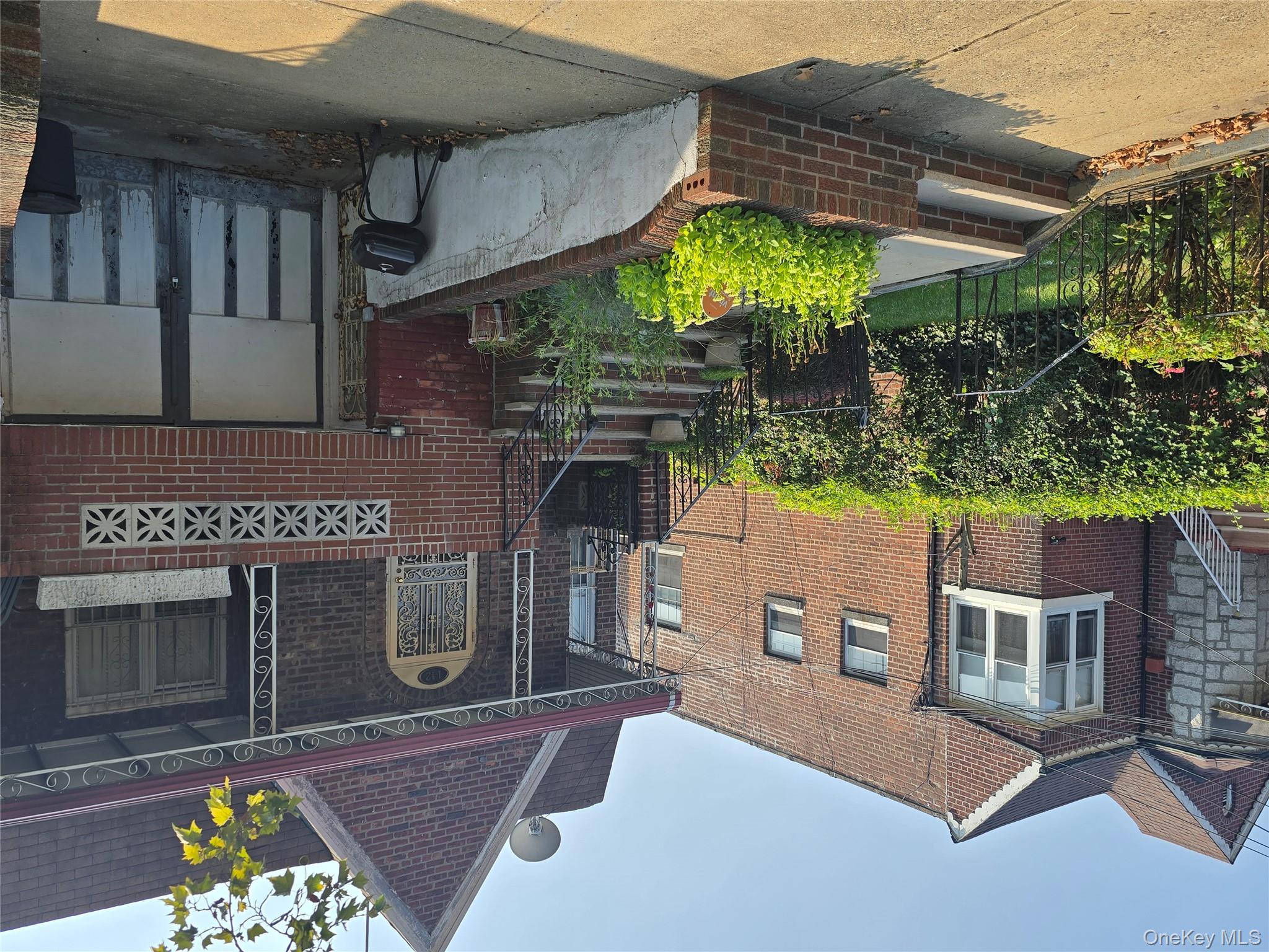 142 East 88th Street Brooklyn, NY 11236 - Photo 14 of 14 a front view of a house with a yard