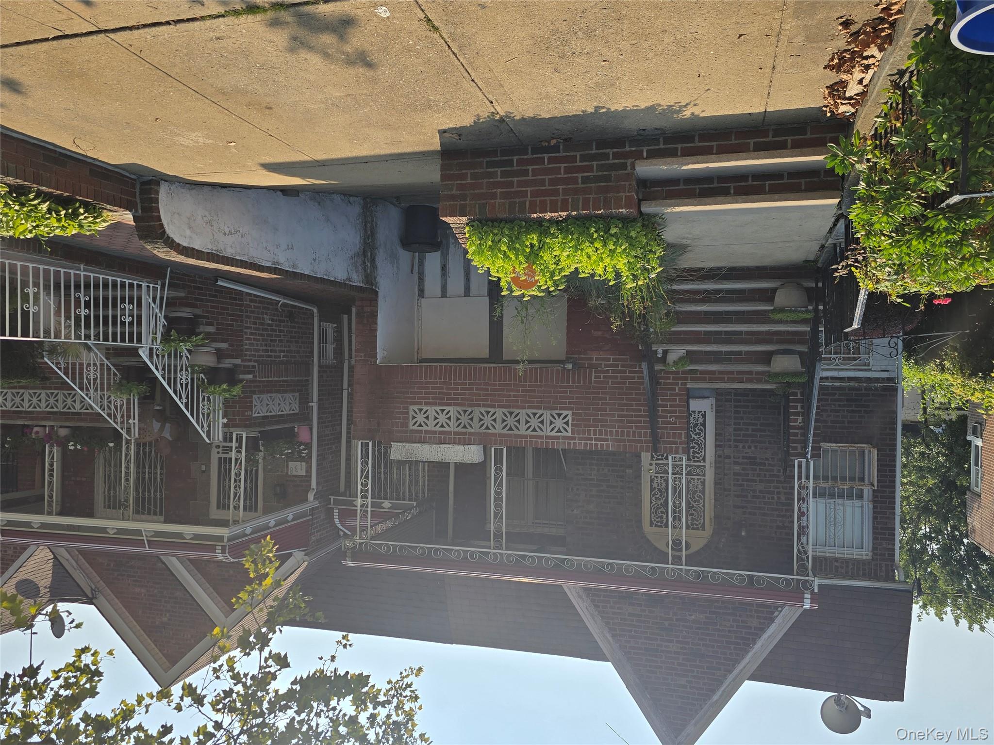 142 East 88th Street Brooklyn, NY 11236 - Photo 3 of 14 a front view of a house with a garden