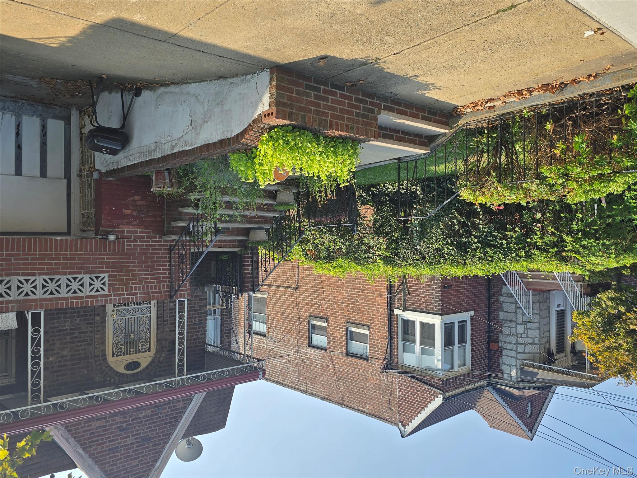 142 East 88th Street Brooklyn, NY 11236 - Photo 7 of 14 a front view of a house with a garden