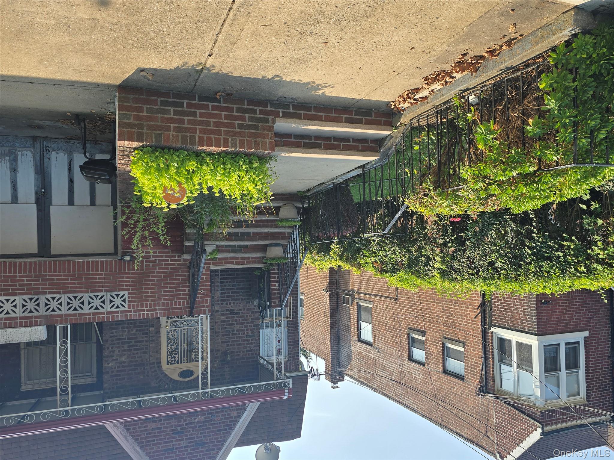 142 East 88th Street Brooklyn, NY 11236 - Photo 9 of 14 a view of a house with potted plants