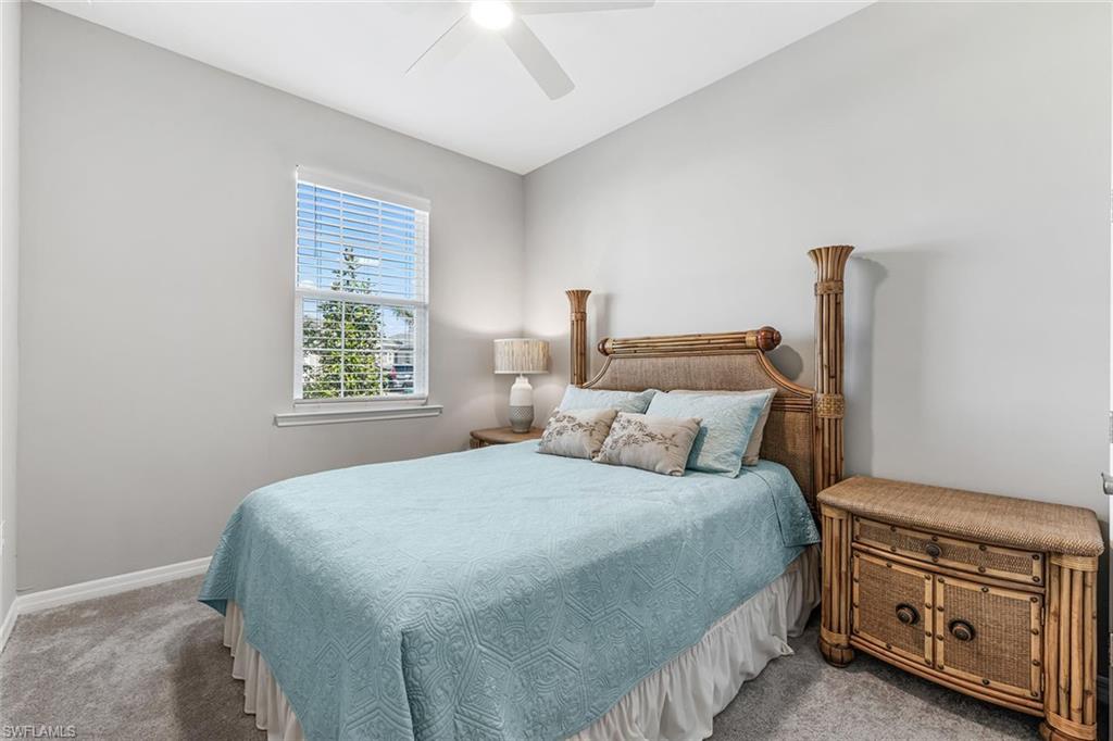 1252 Enbrook Loop Naples, FL 34114 - Photo 14 of 26 a bedroom with a bed and a window