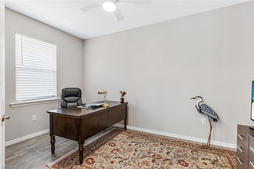 1252 Enbrook Loop Naples, FL 34114 - Photo 17 of 26 a view of workspace with wooden floor
