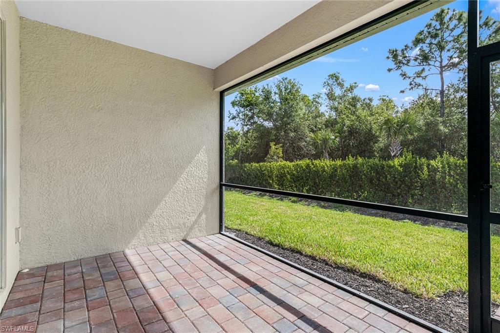 1252 Enbrook Loop Naples, FL 34114 - Photo 19 of 26 a view of a room with wooden floor and a potted plant