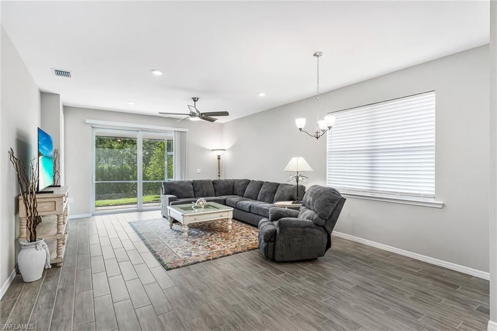 1252 Enbrook Loop Naples, FL 34114 - Photo 9 of 26 a living room with furniture and a large window