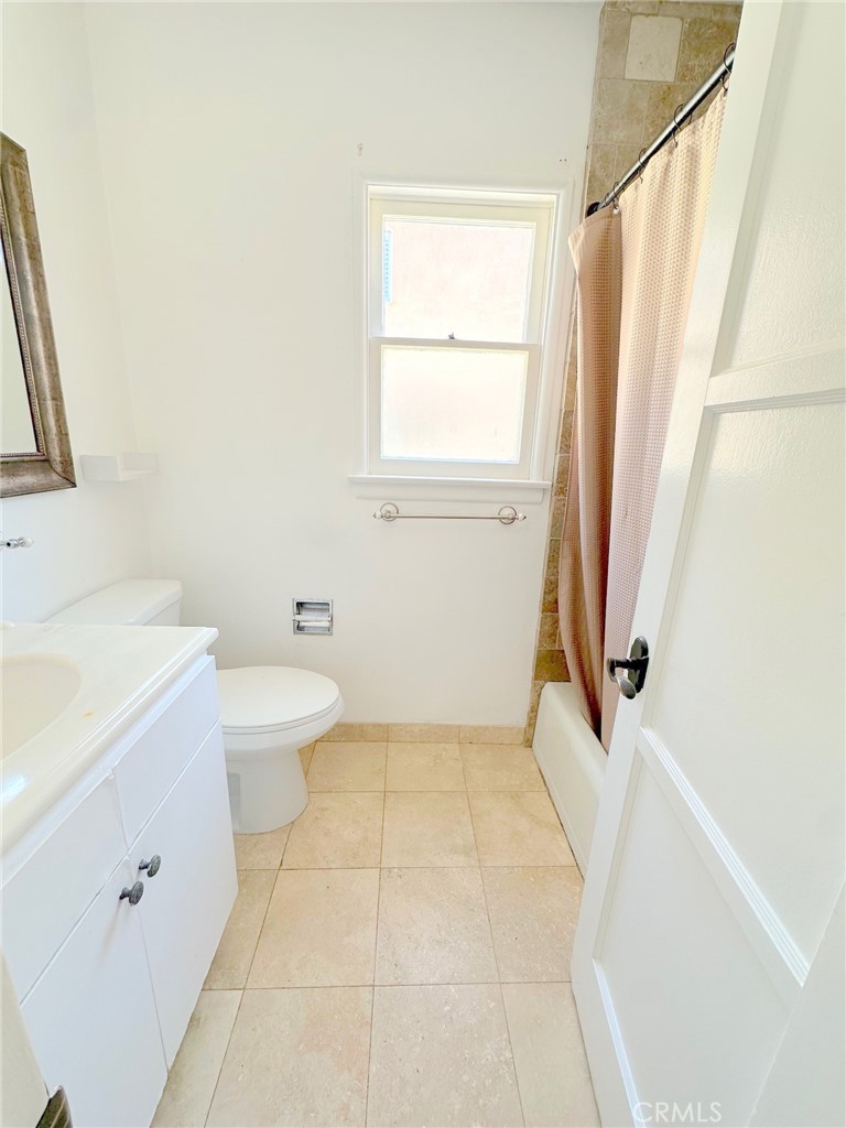 14722 Addison Street Sherman Oaks, CA 91403 - Photo 16 of 22 a bathroom with a sink a toilet and a tub