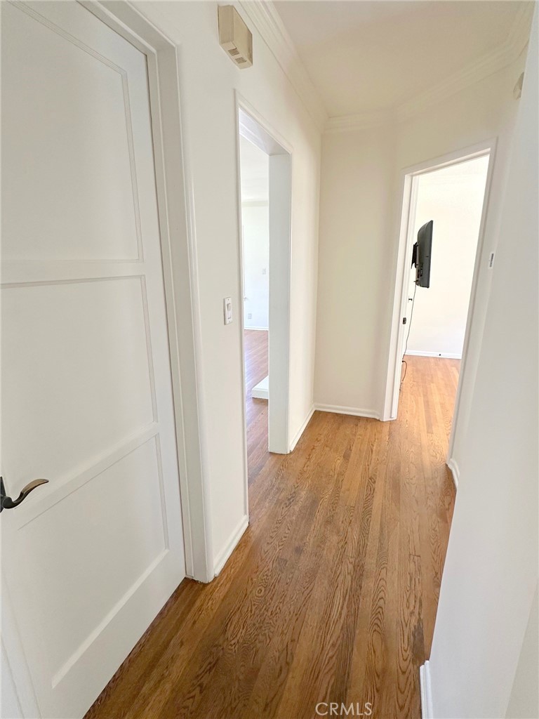 14722 Addison Street Sherman Oaks, CA 91403 - Photo 6 of 22 a view of a hallway with wooden floor and closet