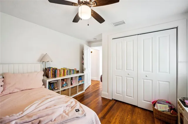 a bedroom with a bed and a dresser