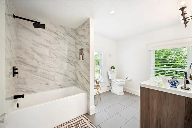 a spacious bathroom with a double vanity sink mirror and