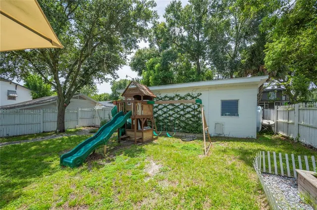 a childrens park with lots of swings and slides