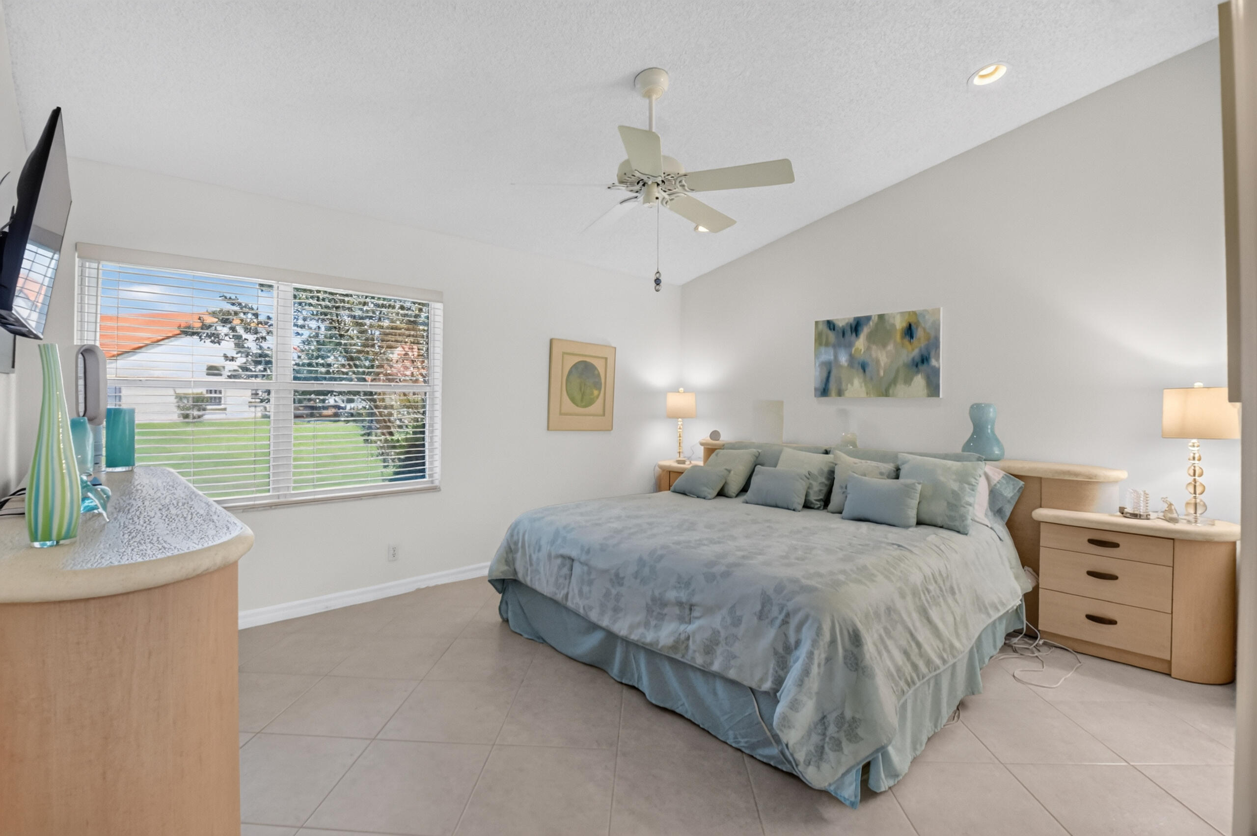 15340 Floral Club Road Delray Beach, FL 33484 - Photo 23 of 42 a bedroom with a large bed and a window