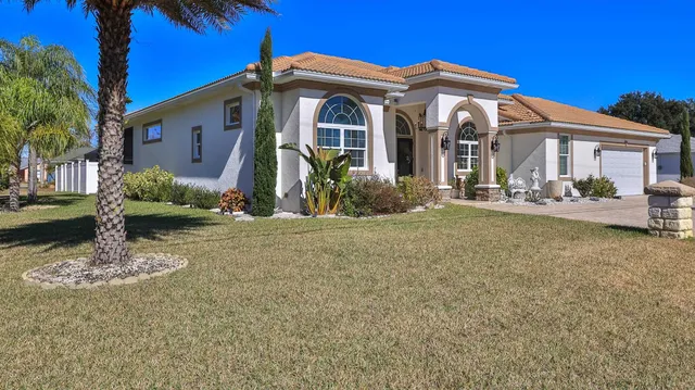 a view of a livingroom with furniture window and wooden floor