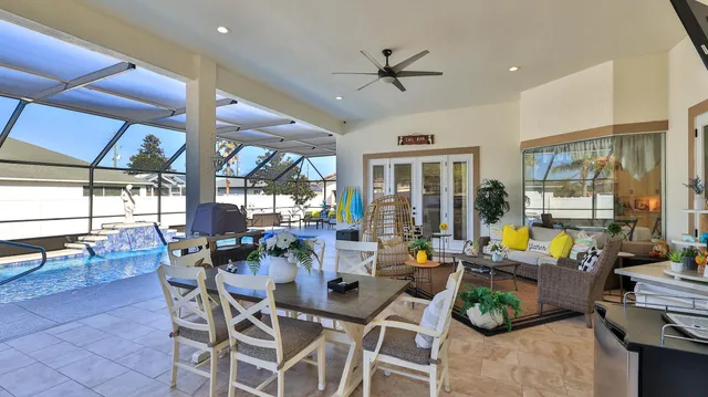 a bedroom with a bed and a mirror on the dresser