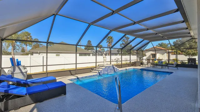 a room with a wooden floor and cabinets