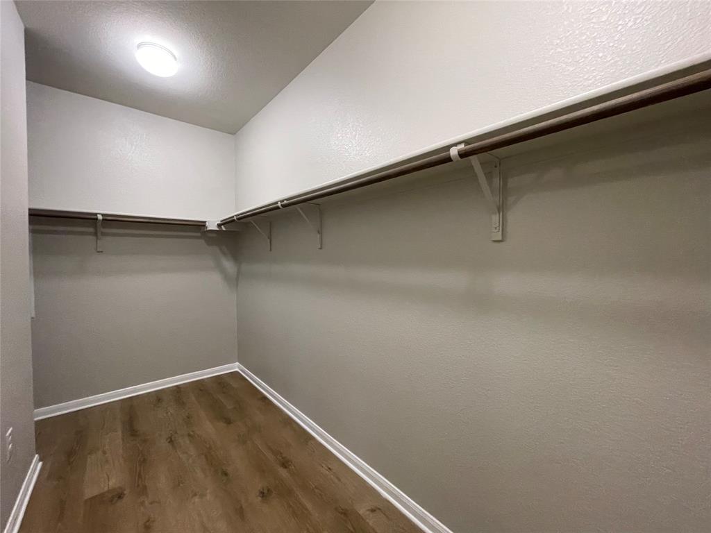 6717 Ranchito Drive Austin, TX 78744 - Photo 12 of 28 Primary bedroom's walk-in closet.