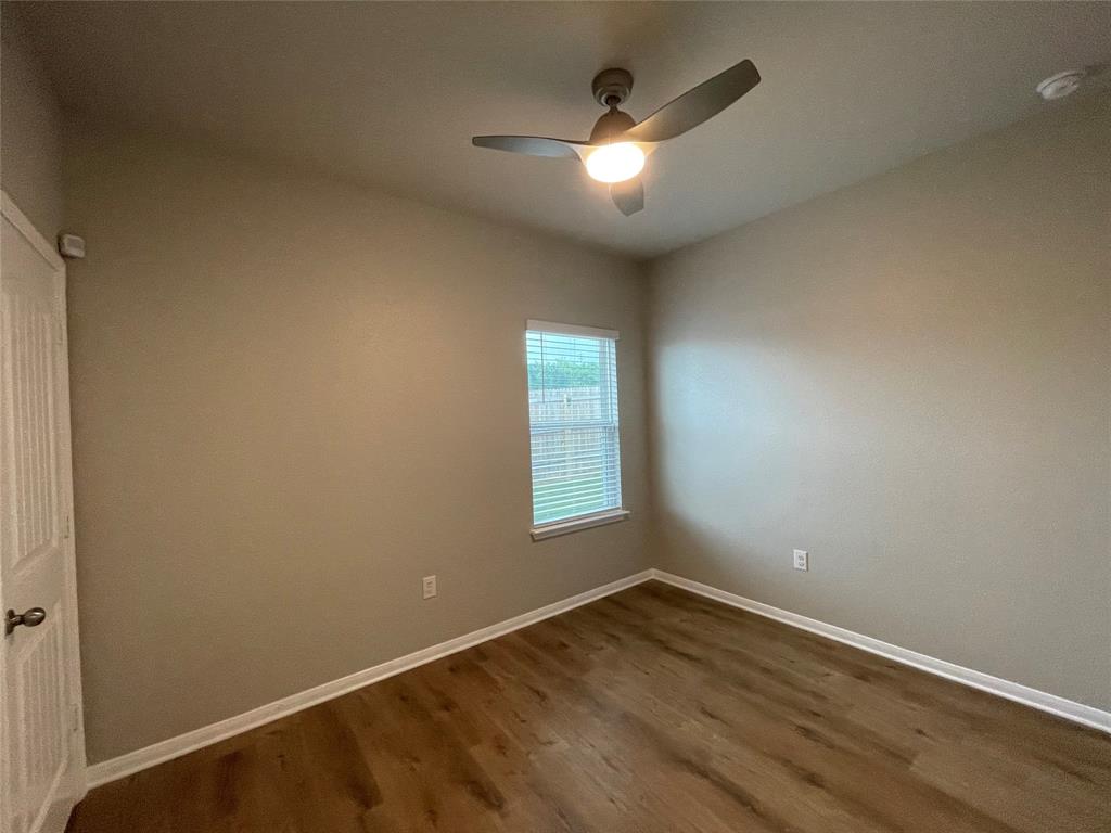 6717 Ranchito Drive Austin, TX 78744 - Photo 16 of 28 This secondary bedroom #2 is airy and light-filled and also includes a modern light fixture with spacious closet.