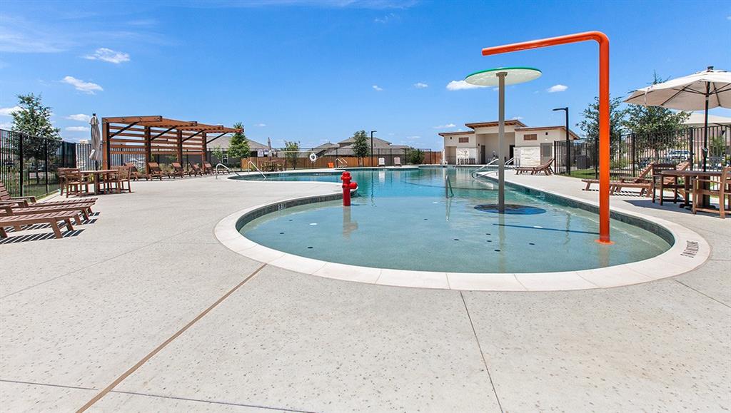 6717 Ranchito Drive Austin, TX 78744 - Photo 27 of 28 Community pool with a patio area