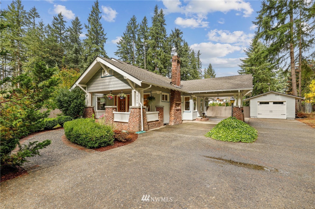 19128 Northeast Redmond Road Redmond, WA 98053 - Photo 1 of 35 a front view of a house with a garden