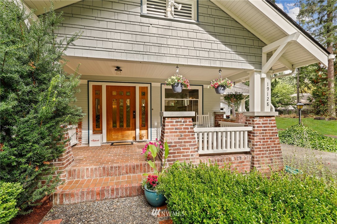 19128 Northeast Redmond Road Redmond, WA 98053 - Photo 2 of 35 a front view of a house with a porch