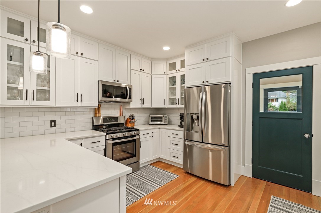 19128 Northeast Redmond Road Redmond, WA 98053 - Photo 12 of 35 a kitchen with stainless steel appliances a refrigerator sink and microwave