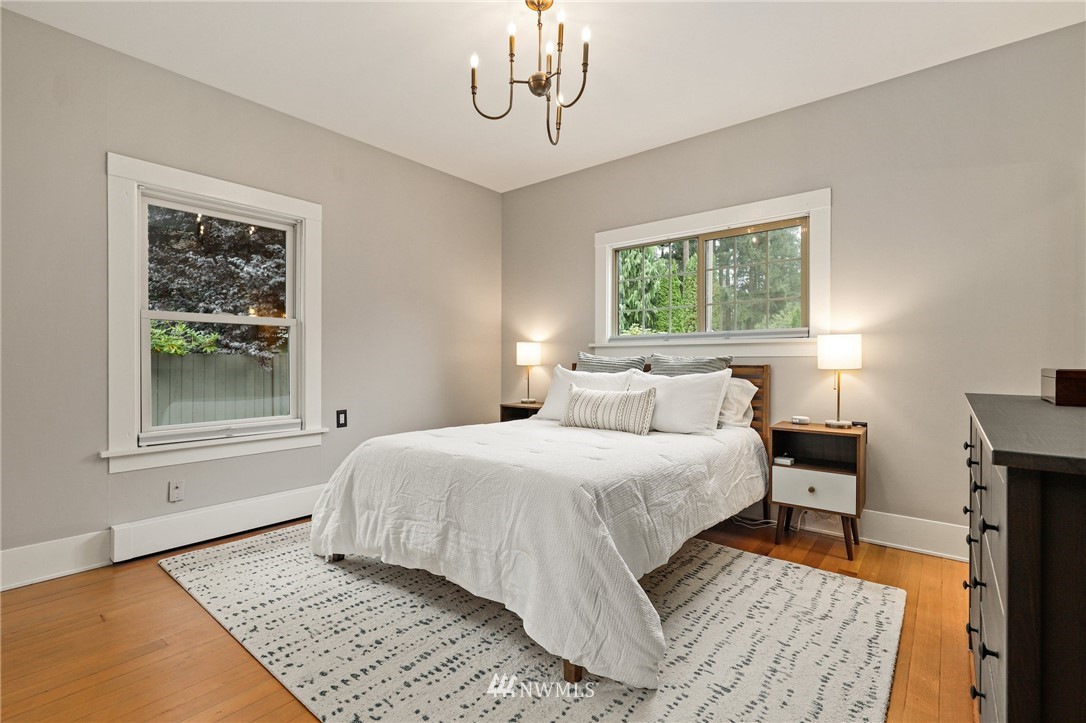 19128 Northeast Redmond Road Redmond, WA 98053 - Photo 15 of 35 a bedroom with a large bed and a window