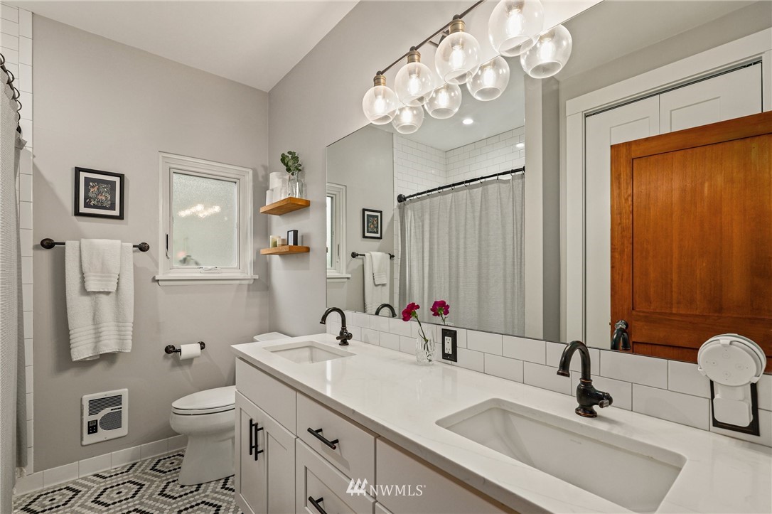 19128 Northeast Redmond Road Redmond, WA 98053 - Photo 20 of 35 a bathroom with a toilet sink and mirror