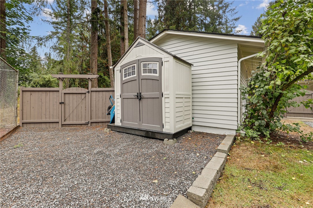 19128 Northeast Redmond Road Redmond, WA 98053 - Photo 28 of 35 a white house covered with tall trees