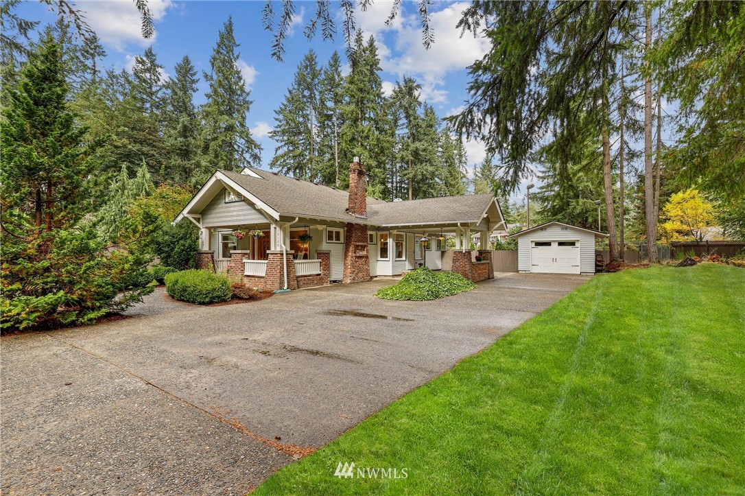 19128 Northeast Redmond Road Redmond, WA 98053 - Photo 34 of 35 a front view of a house with a yard and garage