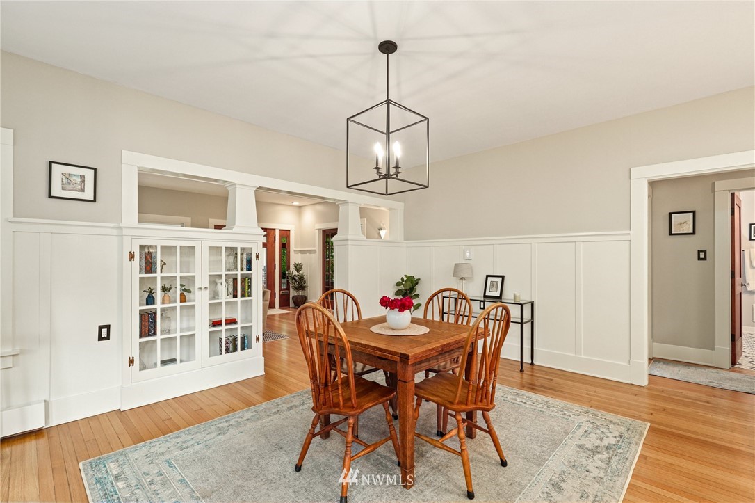 19128 Northeast Redmond Road Redmond, WA 98053 - Photo 9 of 35 a view of a dining room with furniture wooden floor and chandelier