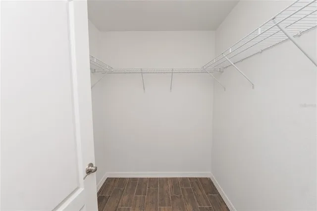 a bathroom with a bathtub a sink and a large mirror