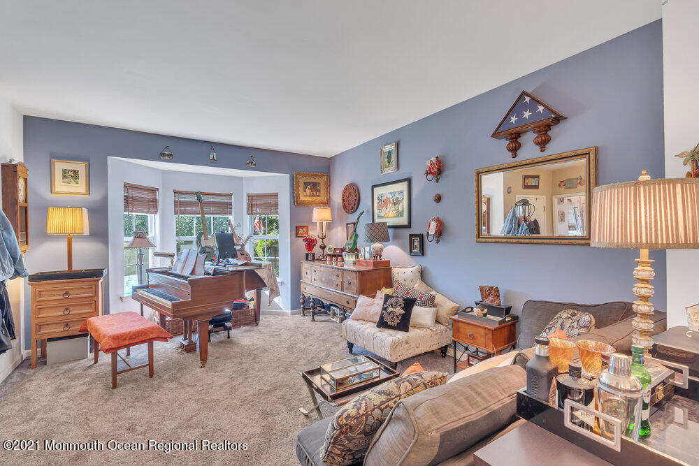 954 Hyson Road Jackson, NJ 08527 - Photo 8 of 54 a living room with furniture and a window