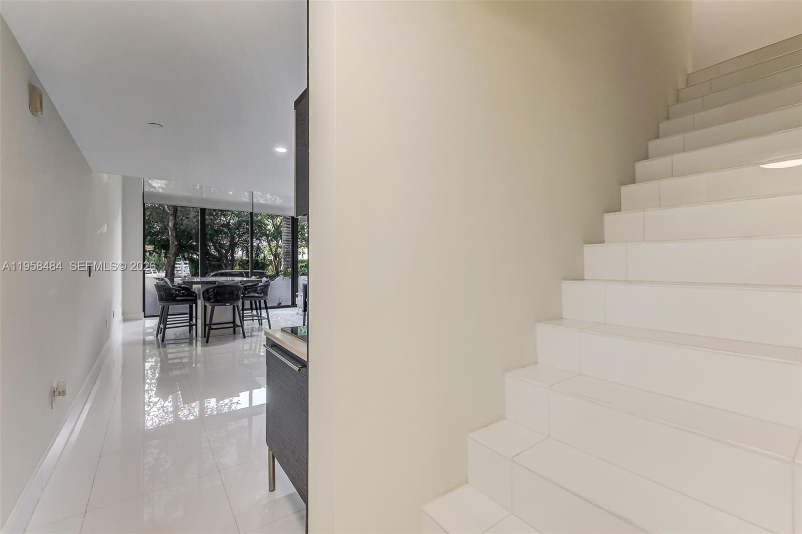 6000 Collins Avenue, Unit 112 Miami Beach, FL 33140 - Photo 19 of 53 a view of entryway and hall with dining area