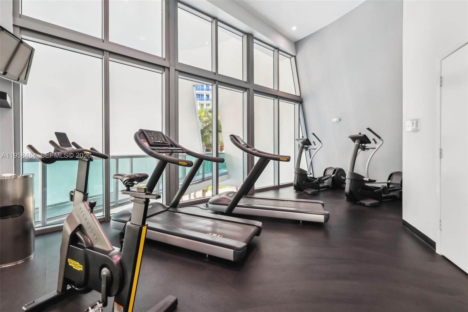 6000 Collins Avenue, Unit 112 Miami Beach, FL 33140 - Photo 42 of 53 a view of a room with gym equipment