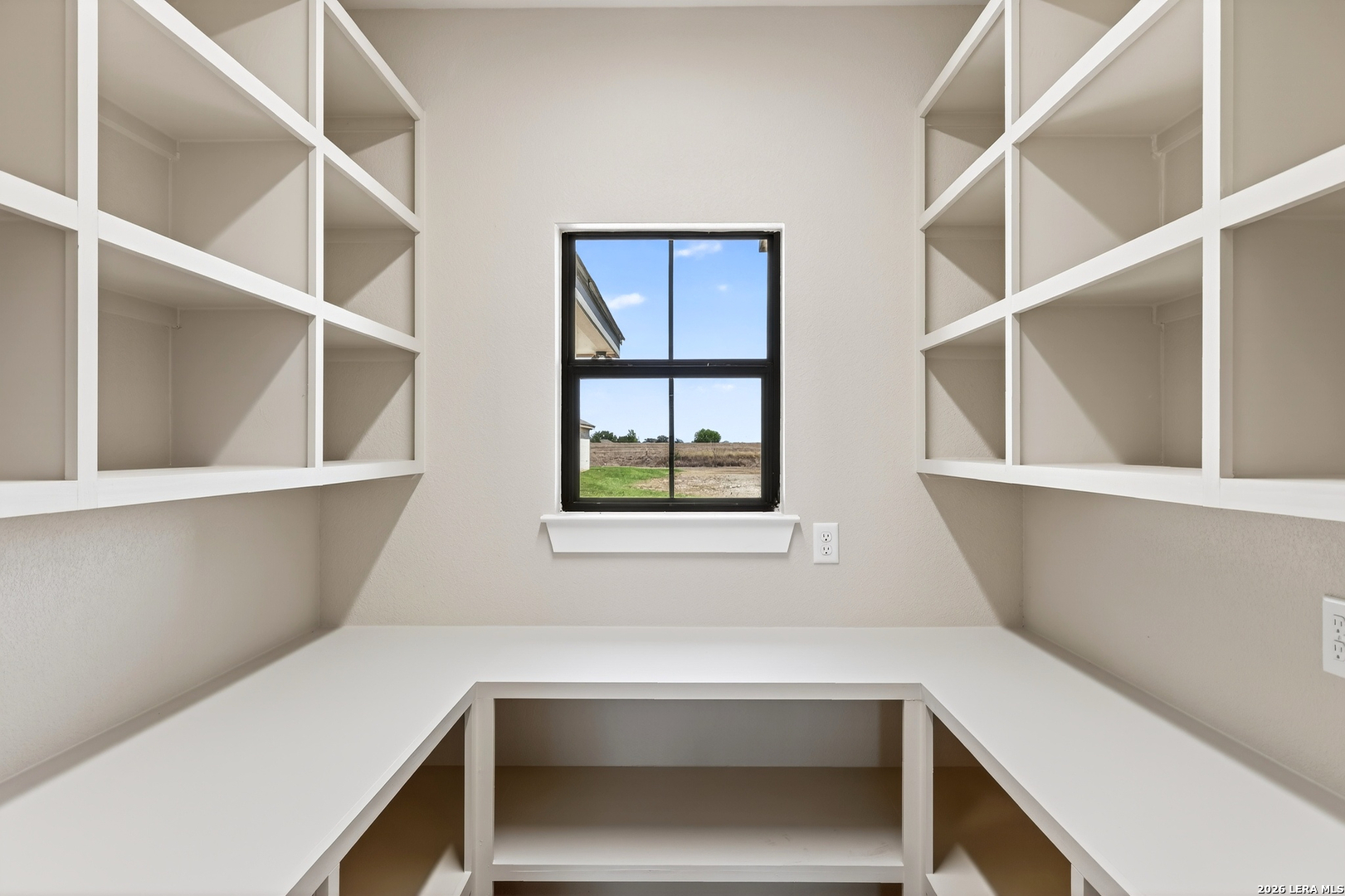 721 North Dickson Street Poth, TX 78147 - Photo 19 of 40 a view of room with a window and cabinet
