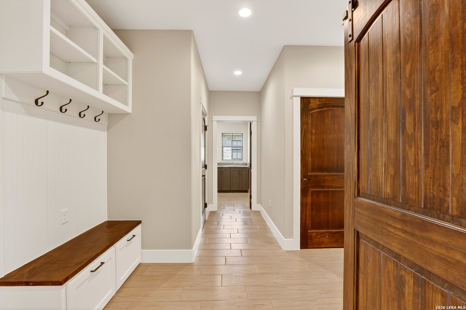 721 North Dickson Street Poth, TX 78147 - Photo 20 of 40 a view of a hallway with wooden floor and entryway