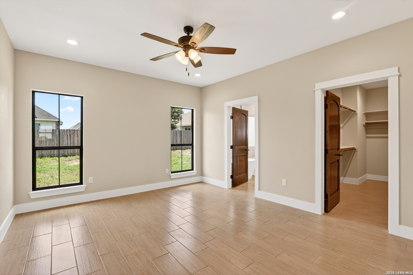 721 North Dickson Street Poth, TX 78147 - Photo 24 of 40 a view of an empty room with window and wooden floor