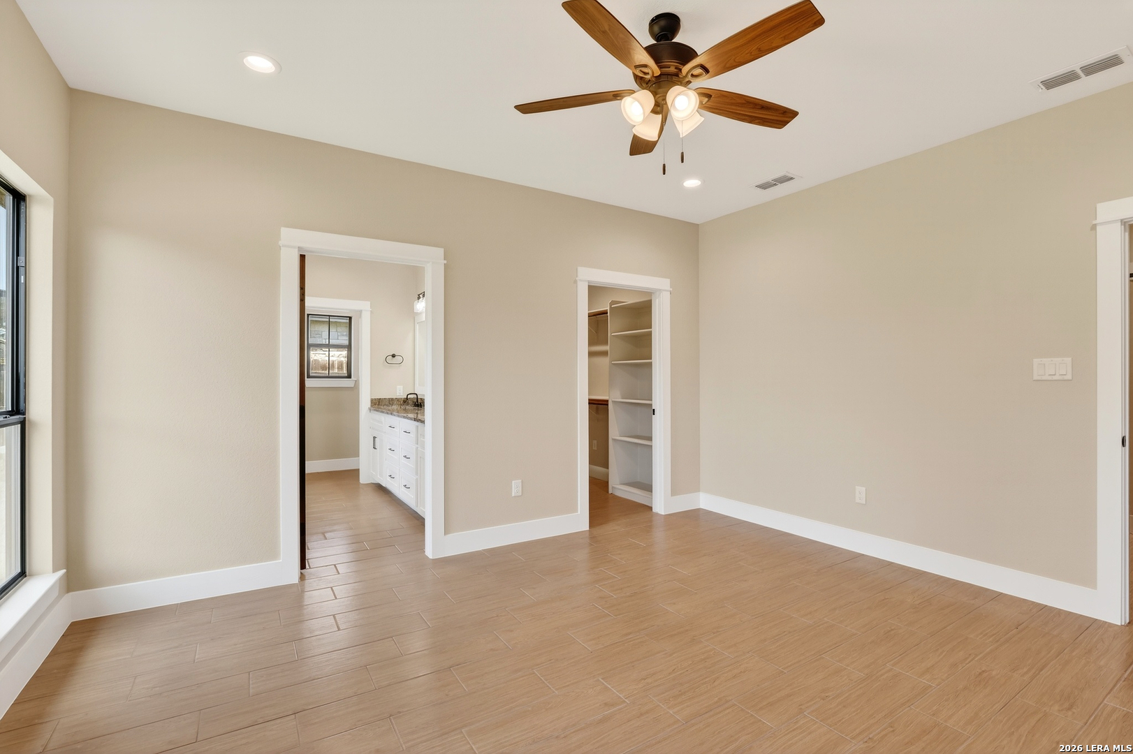 721 North Dickson Street Poth, TX 78147 - Photo 25 of 40 an empty room with closet and a ceiling fan