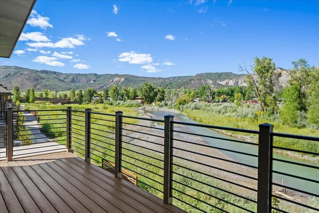 a view of a balcony with an outdoor seating